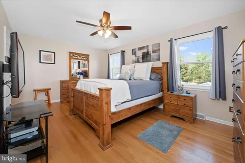 a bed room with a bed and a window