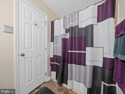 a view of a living room with furniture and a window