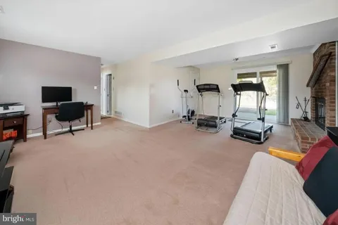 a view of a livingroom with furniture and a flat screen tv