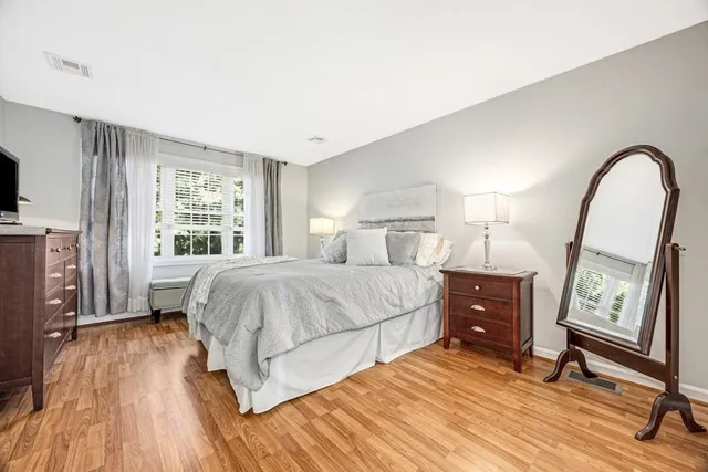 a bed room with a bed and a window