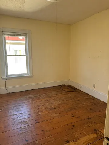 a view of a living room with furniture and a window