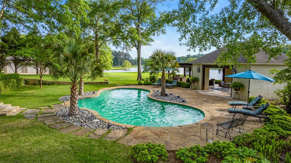 3920 Smelley Road Longview, TX 75605 - Photo 3 of 35 a view of a swimming pool with a patio