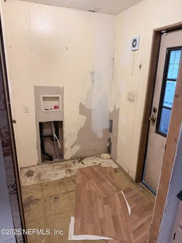 a bedroom with a bed and a mirror