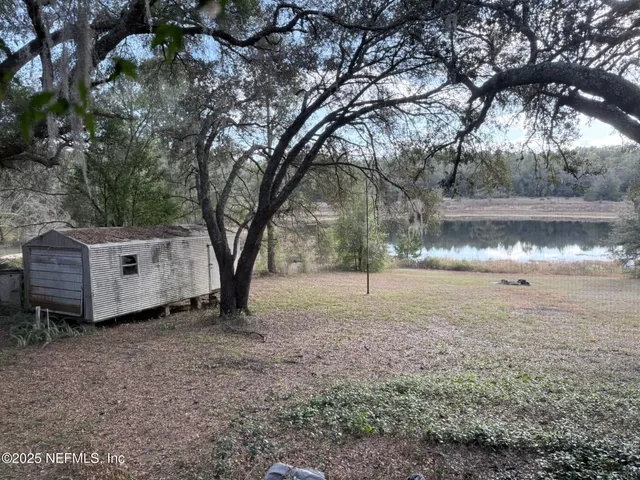 a backyard of a house with lots of green space