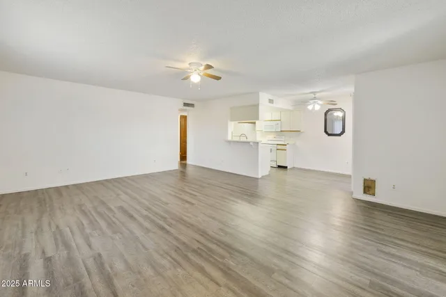 a view of a kitchen with electric appliances
