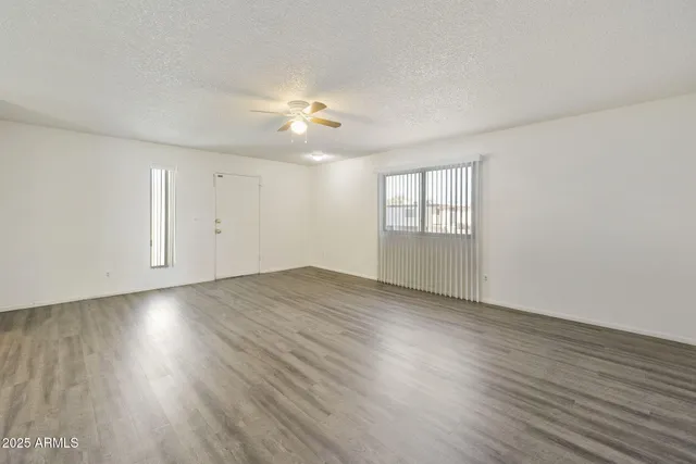a view of kitchen with wooden floor and electronic appliances