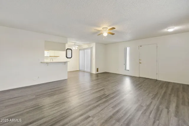 a kitchen with granite countertop a sink stainless steel appliances and cabinets