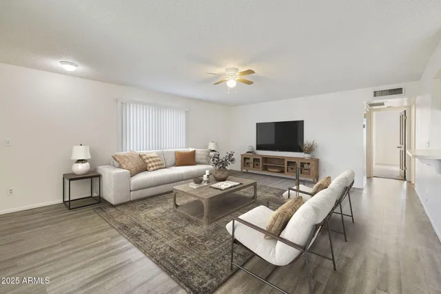 a kitchen with white cabinets sink and white stainless steel appliances