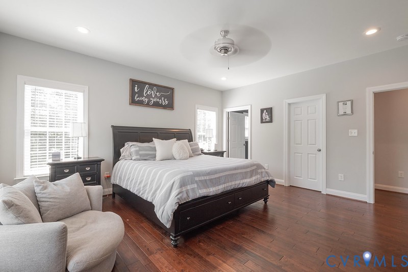 9425 Marie Road New Kent, VA 23124 - Photo 11 of 55 a spacious bedroom with a bed and a couch