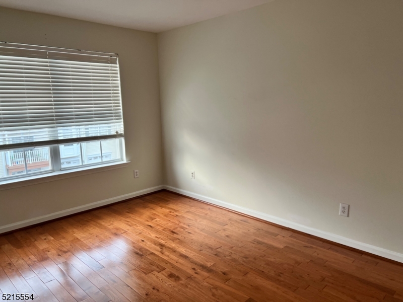8 Worthington Terrace Flemington, NJ 08822 - Photo 14 of 18 an empty room with wooden floor and windows