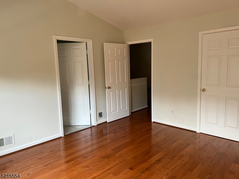 8 Worthington Terrace Flemington, NJ 08822 - Photo 10 of 18 an empty room with wooden floor & closet area