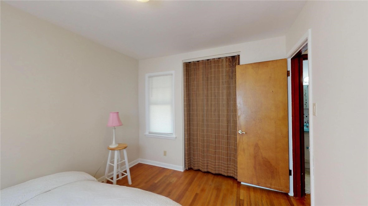 9 Maple Court Decatur, IL 62526 - Photo 18 of 25 a bedroom with a bed and wooden floor