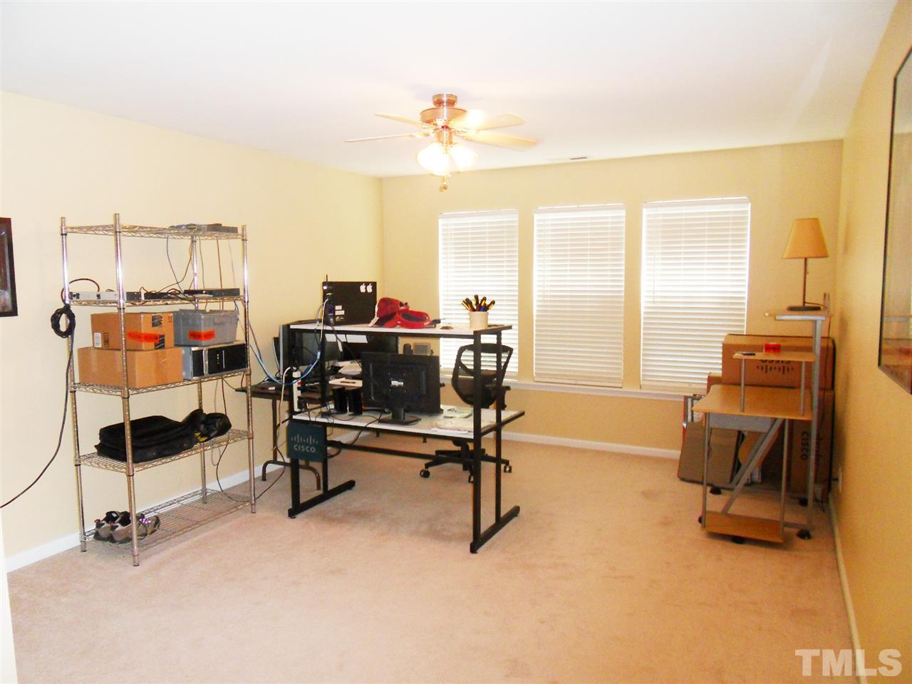 5327 Griffith Park Road Raleigh, NC 27613 - Photo 13 of 25 a view of a workspace with furniture and a window