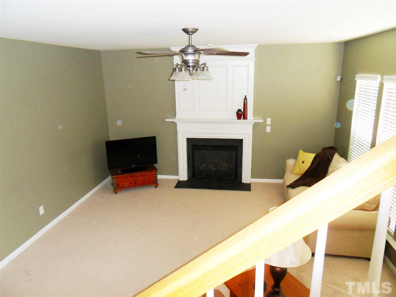 5327 Griffith Park Road Raleigh, NC 27613 - Photo 15 of 25 a living room with furniture and a fireplace