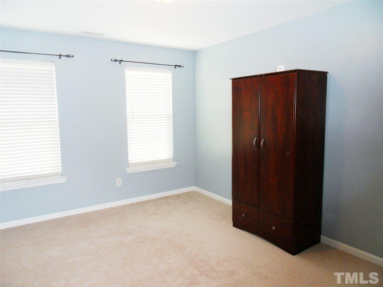 5327 Griffith Park Road Raleigh, NC 27613 - Photo 10 of 25 an empty room with windows and closet