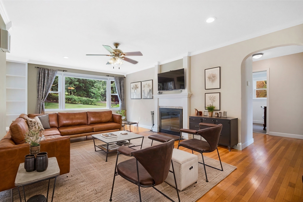 65 Bartels Street Springfield, MA 01128 - Photo 15 of 42 a living room with furniture a fireplace and a flat screen tv