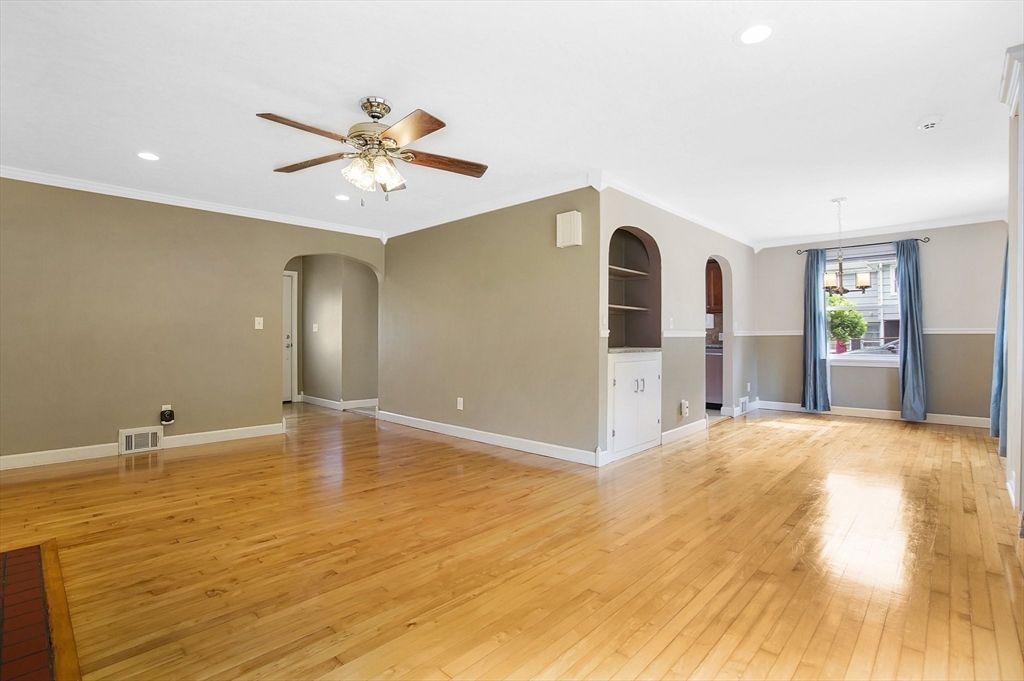 65 Bartels Street Springfield, MA 01128 - Photo 20 of 42 a view of an empty room and window with wooden floor