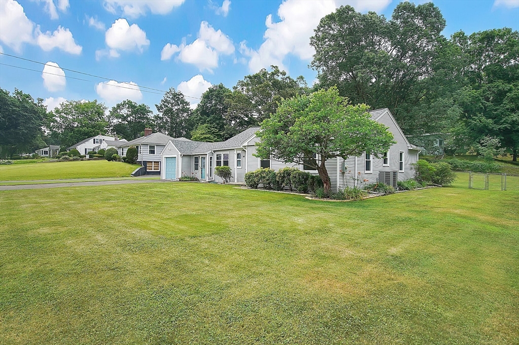 65 Bartels Street Springfield, MA 01128 - Photo 2 of 42 a house view with swimming pool and trees in the background
