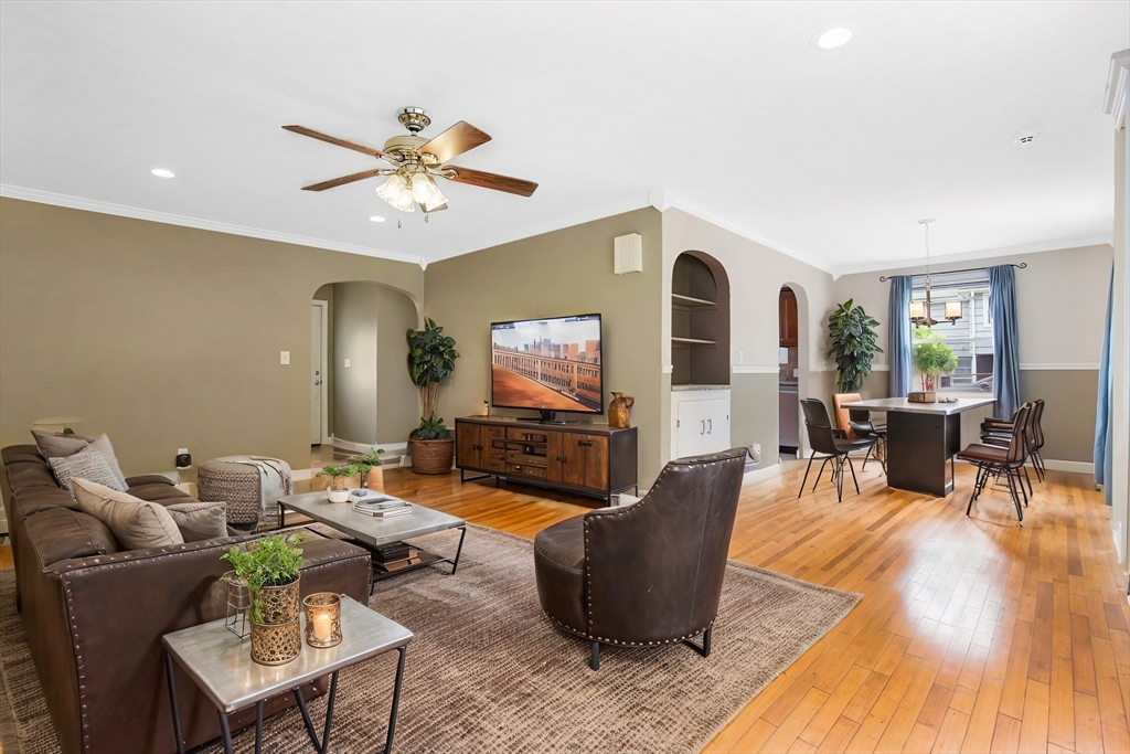 65 Bartels Street Springfield, MA 01128 - Photo 21 of 42 a living room with furniture a fireplace and a flat screen tv