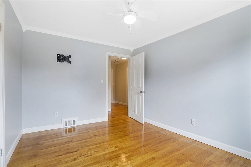 65 Bartels Street Springfield, MA 01128 - Photo 29 of 42 a view of an empty room with wooden floor