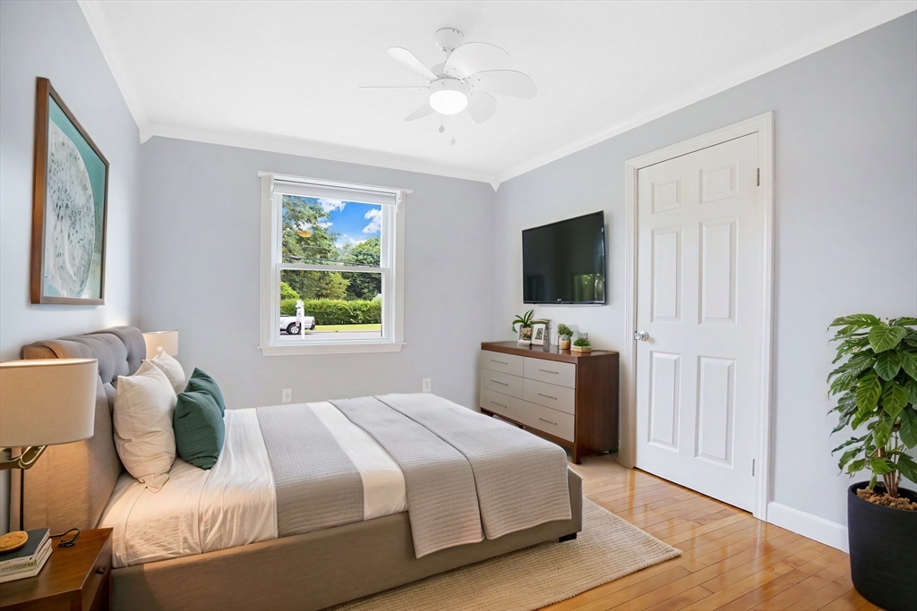 65 Bartels Street Springfield, MA 01128 - Photo 31 of 42 a bedroom with a bed and a flat screen tv