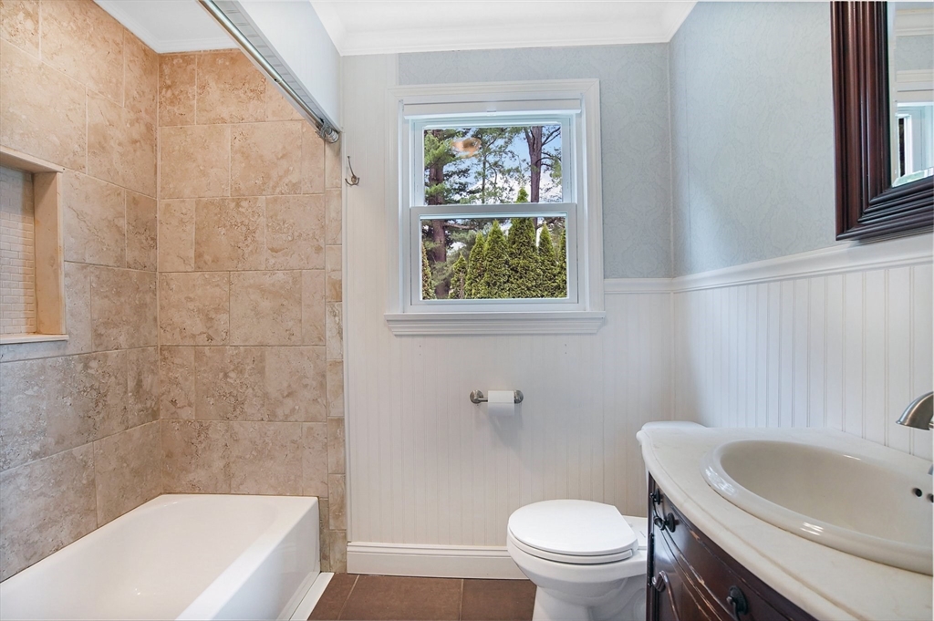 65 Bartels Street Springfield, MA 01128 - Photo 35 of 42 a bath room with a toilet a sink and a bath tub