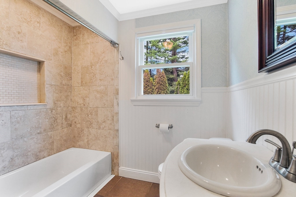 65 Bartels Street Springfield, MA 01128 - Photo 36 of 42 a bathroom with a sink and a bathtub