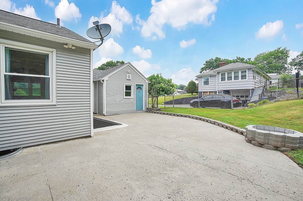 65 Bartels Street Springfield, MA 01128 - Photo 37 of 42 a view of a house with a yard and porch