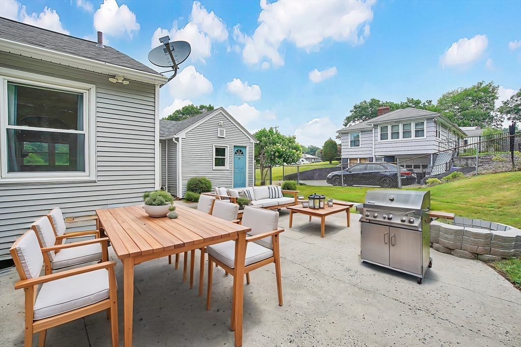 65 Bartels Street Springfield, MA 01128 - Photo 38 of 42 a view of a dinning table and chairs in the patio