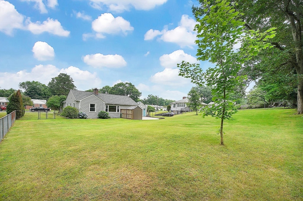 65 Bartels Street Springfield, MA 01128 - Photo 41 of 42 a view of a house with a backyard