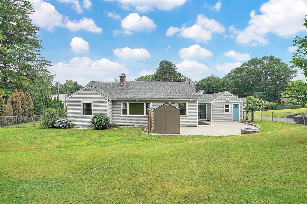 65 Bartels Street Springfield, MA 01128 - Photo 42 of 42 a front view of a house with yard and green space