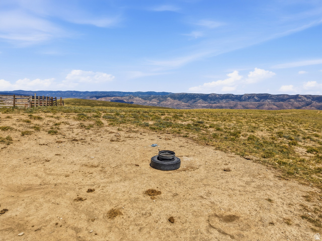 10780 Ford Ridge Road Helper, UT 84526 - Photo 27 of 38 Expansive terrain with distant mountain ranges and a rustic wood fence line