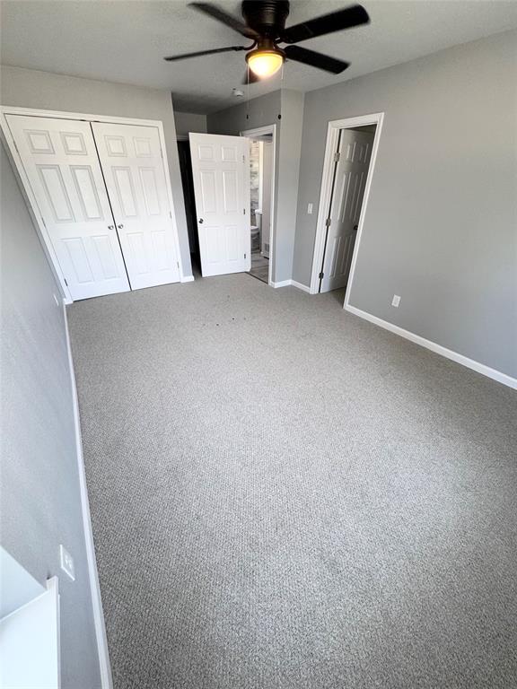 1736 Ransom Terrace Fort Worth, TX 76112 - Photo 19 of 27 Light gray wall-to-wall carpeting with soft gray wall paint.