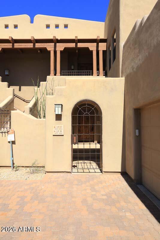 36601 North Mule Train Road, Unit 13D Carefree, AZ 85377 - Photo 1 of 51 a front view of a house with a yard