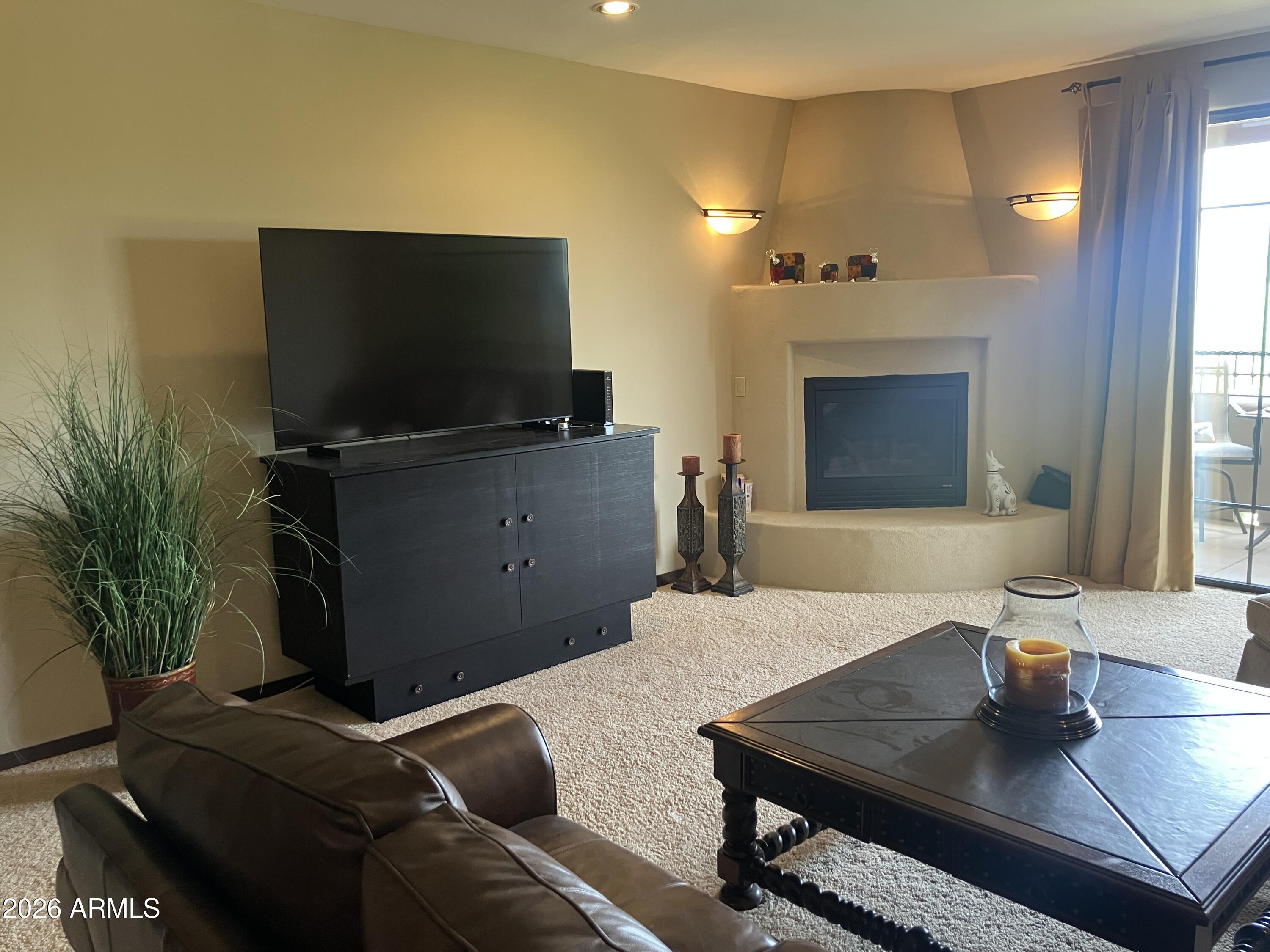 36601 North Mule Train Road, Unit 13D Carefree, AZ 85377 - Photo 11 of 51 a living room with furniture and a flat screen tv