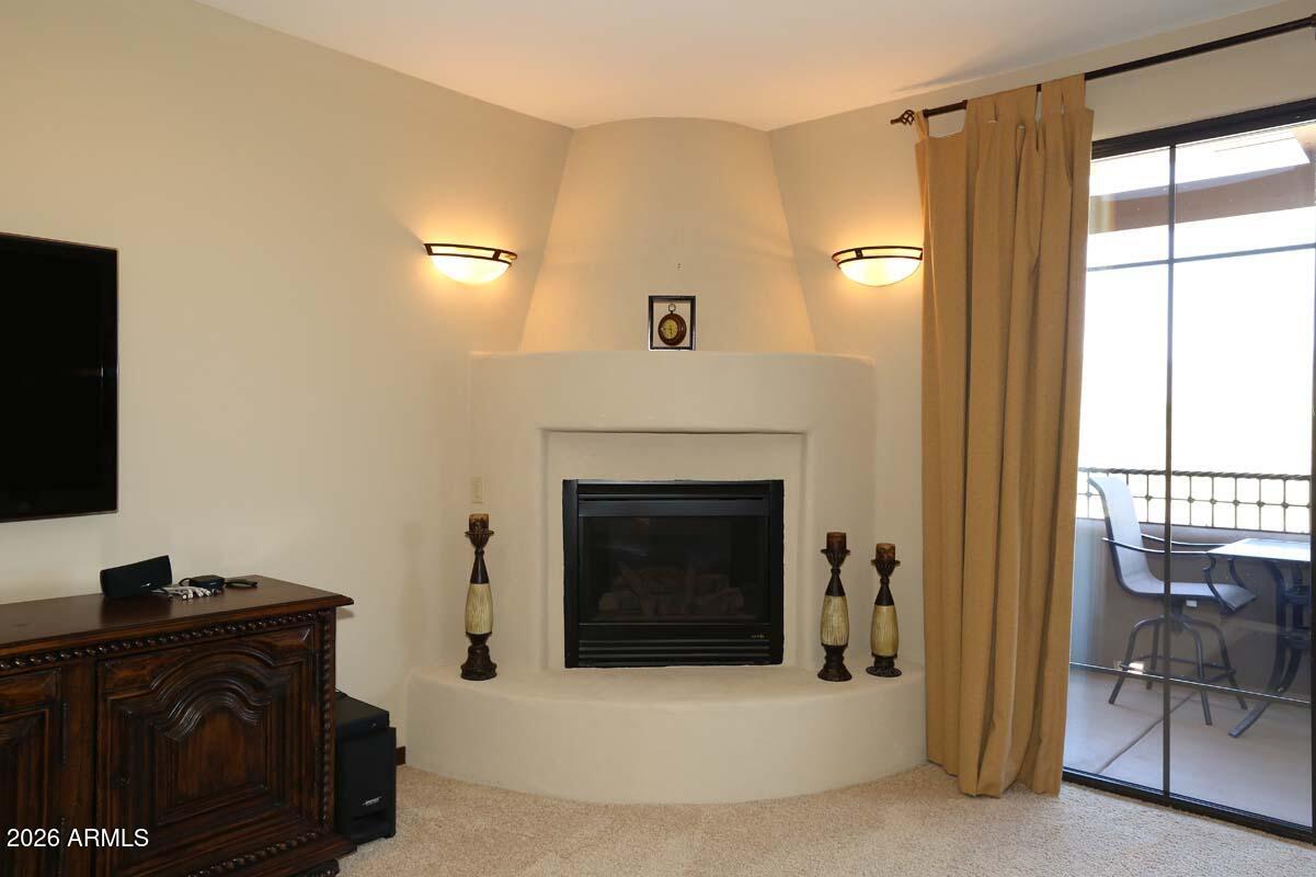 36601 North Mule Train Road, Unit 13D Carefree, AZ 85377 - Photo 13 of 51 a living room with furniture and a fireplace