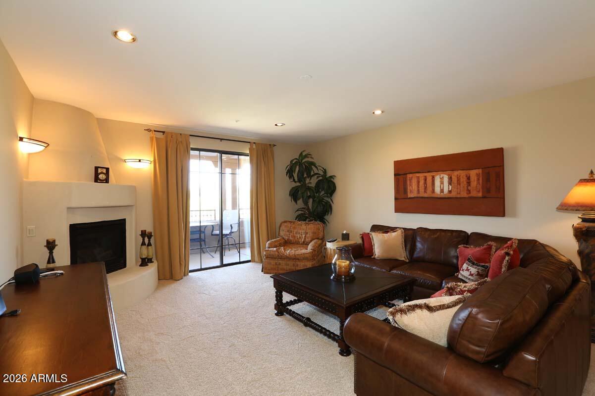 36601 North Mule Train Road, Unit 13D Carefree, AZ 85377 - Photo 14 of 51 a living room with furniture and a fireplace