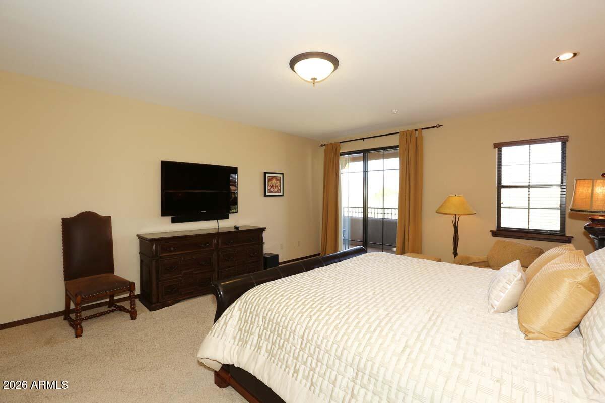 36601 North Mule Train Road, Unit 13D Carefree, AZ 85377 - Photo 16 of 51 a bedroom with a bed and a flat screen tv