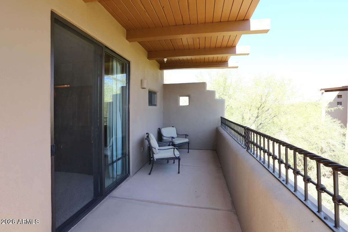 36601 North Mule Train Road, Unit 13D Carefree, AZ 85377 - Photo 40 of 51 a balcony with furniture and a potted plant