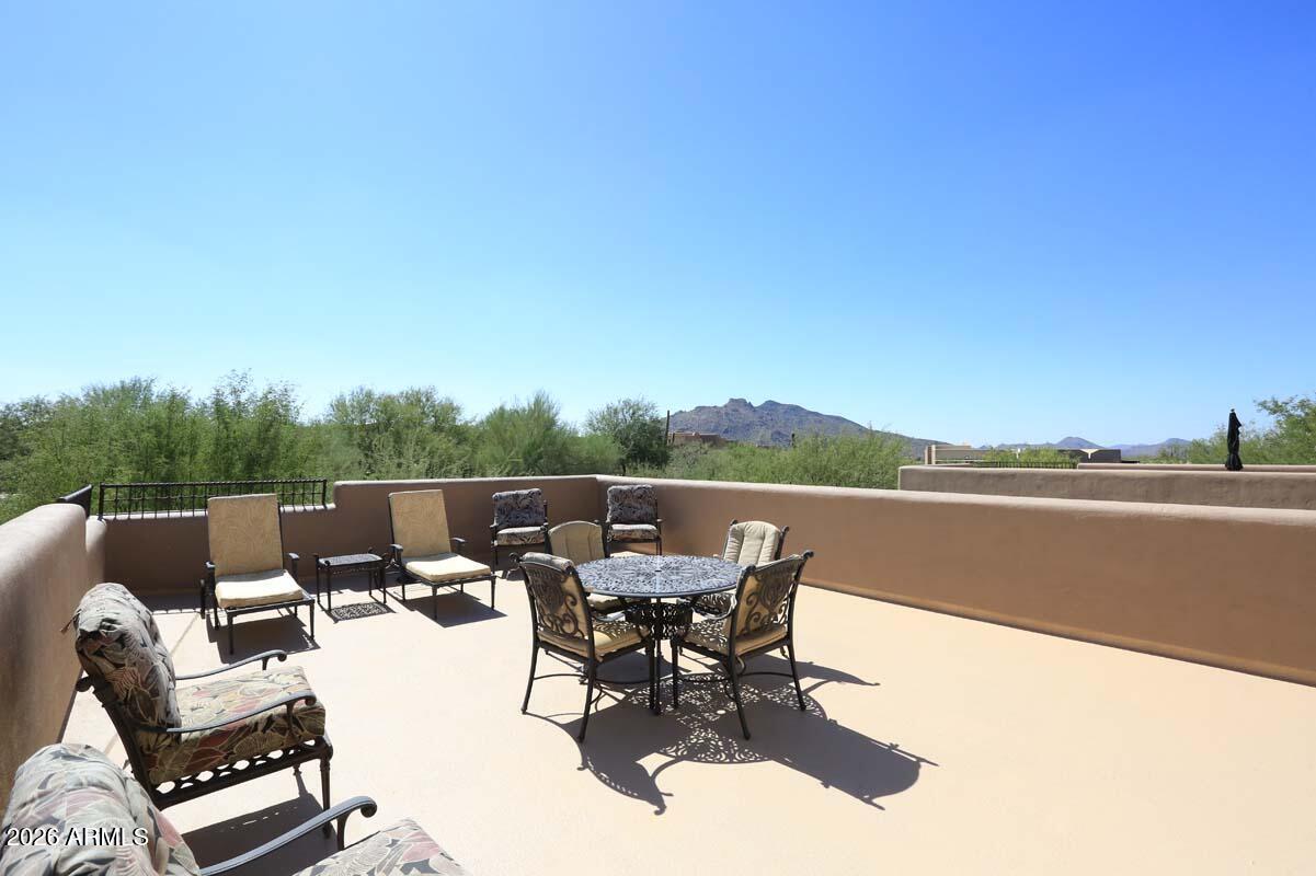 36601 North Mule Train Road, Unit 13D Carefree, AZ 85377 - Photo 46 of 51 a view of a terrace with couches and a table