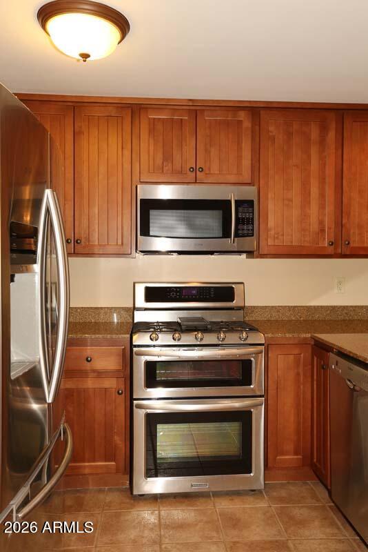 36601 North Mule Train Road, Unit 13D Carefree, AZ 85377 - Photo 6 of 51 a kitchen with a stove and a microwave