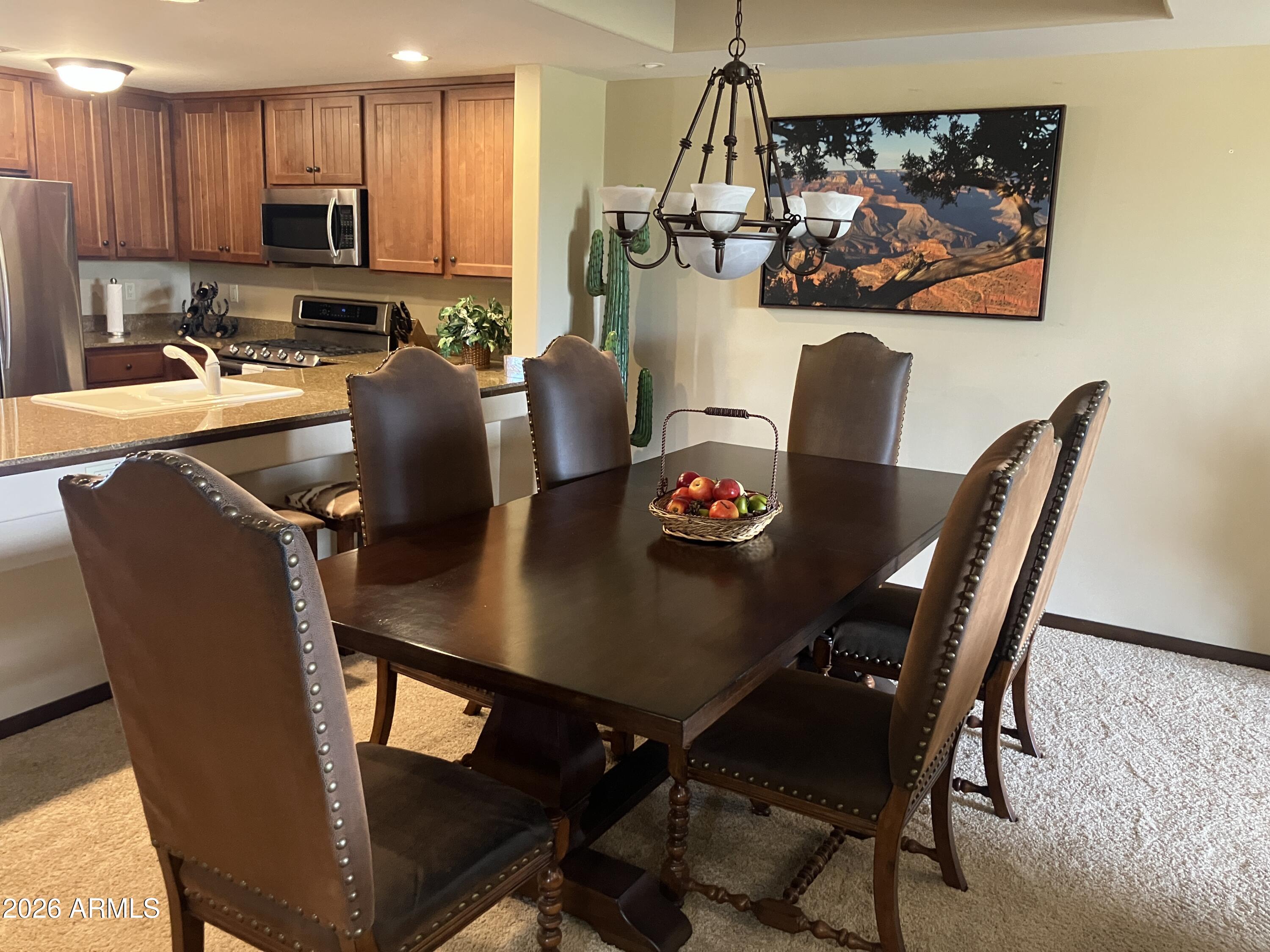 36601 North Mule Train Road, Unit 13D Carefree, AZ 85377 - Photo 9 of 51 a view of a dining room with furniture