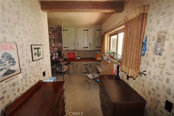 a kitchen with stainless steel appliances a refrigerator and a stove top oven