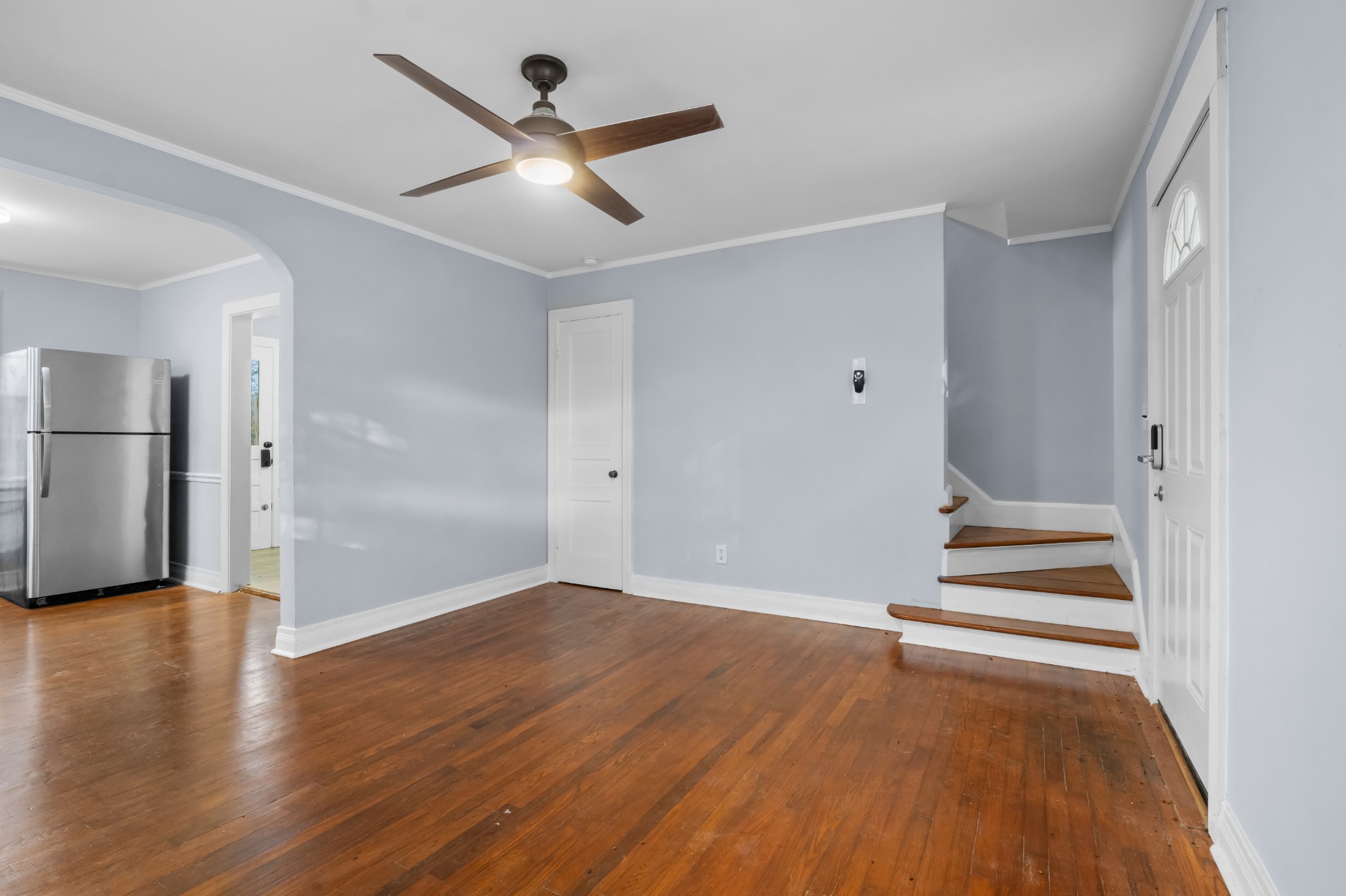 1815 Ragland Avenue Murfreesboro, TN 37130 - Photo 4 of 15 an empty room with wooden floor and a ceiling fan