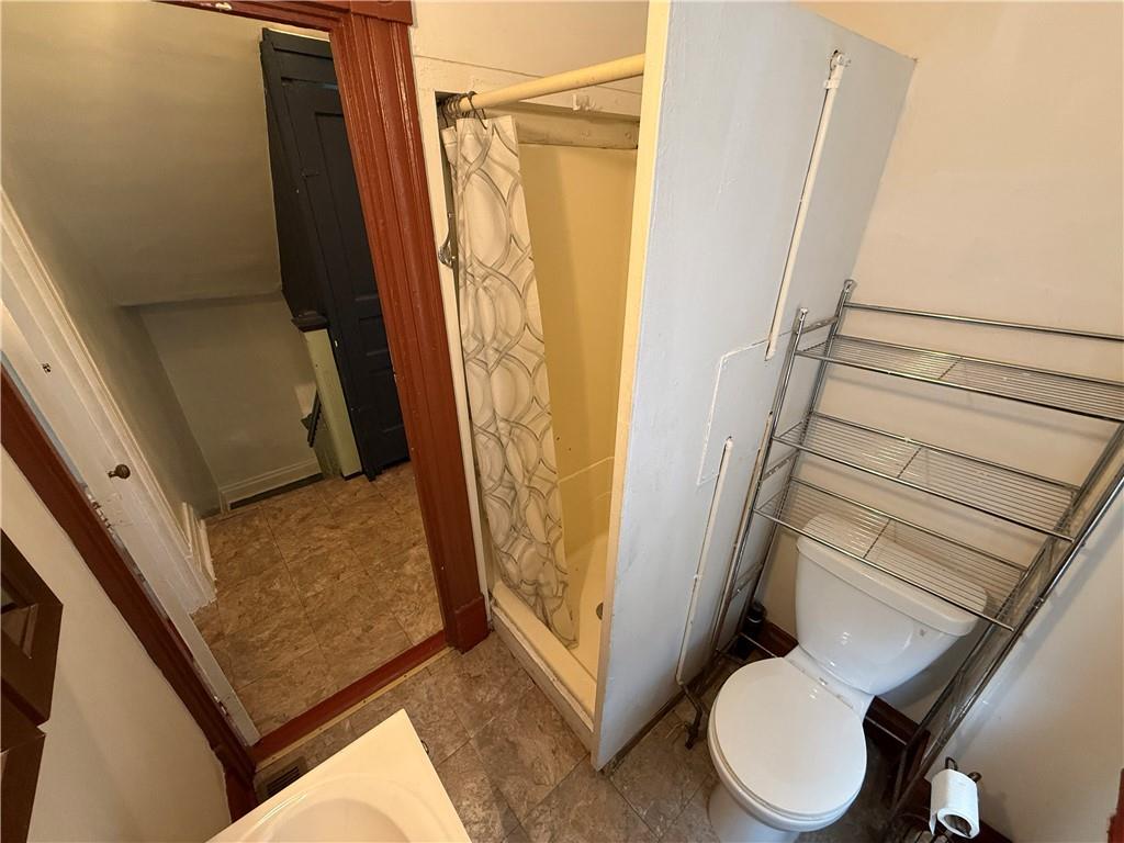 14 Shank Street Pittsburgh, PA 15212 - Photo 16 of 30 a bathroom with a sink a toilet a mirror and shower