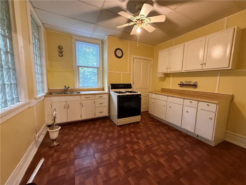 14 Shank Street Pittsburgh, PA 15212 - Photo 7 of 30 a kitchen with stainless steel appliances a stove a sink and cabinets