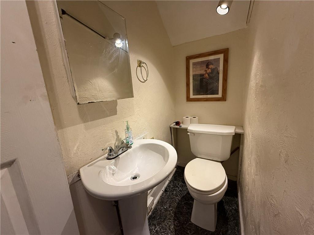 14 Shank Street Pittsburgh, PA 15212 - Photo 8 of 30 a bathroom with a toilet sink and mirror