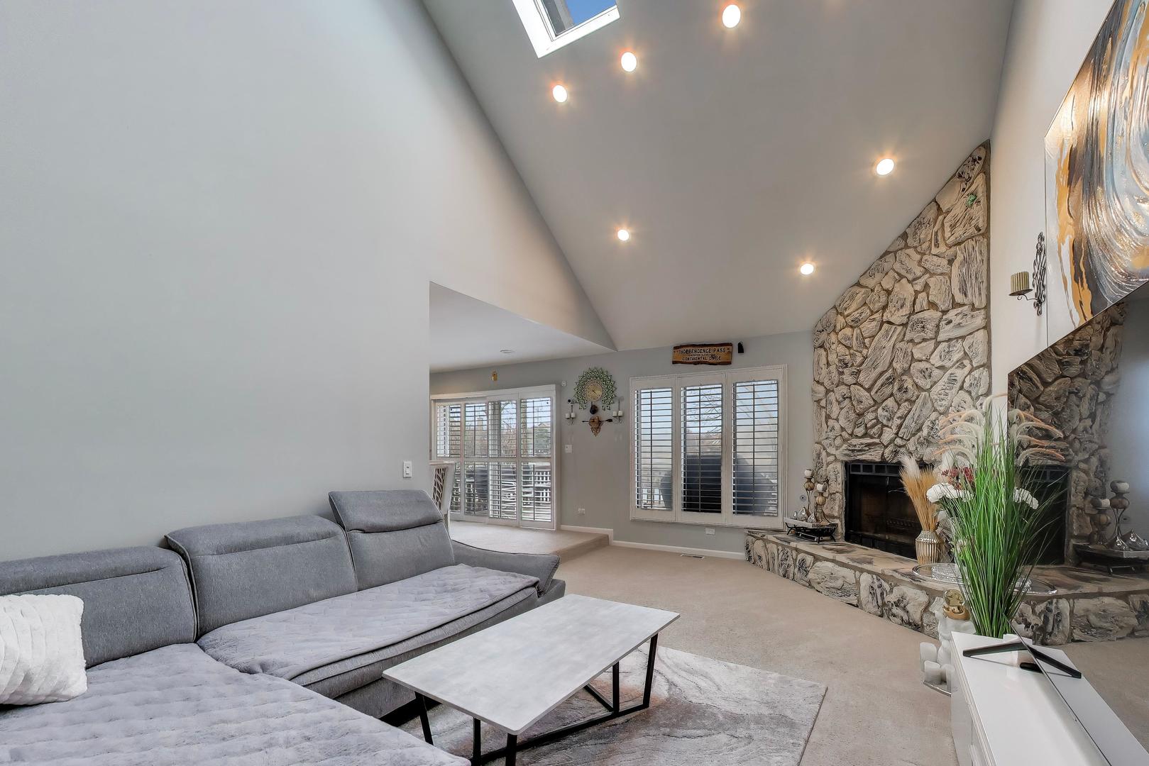 654 Picardy Circle Northbrook, IL 60062 - Photo 12 of 26 a living room with furniture and a fireplace