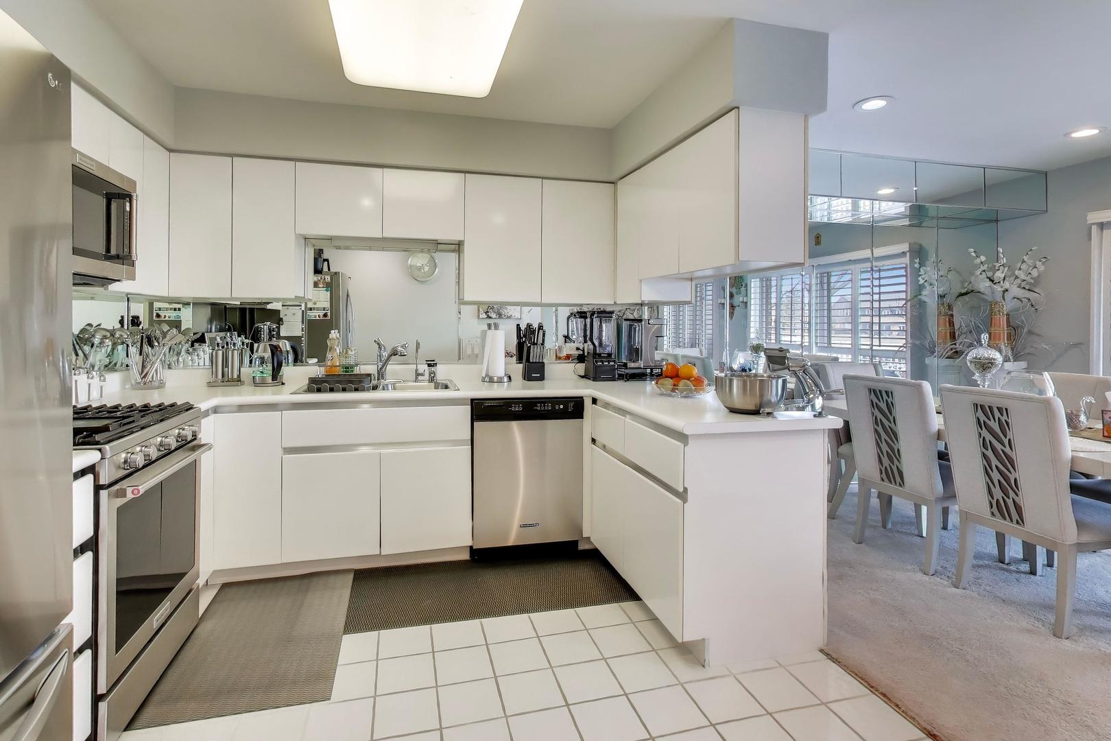 654 Picardy Circle Northbrook, IL 60062 - Photo 8 of 26 a kitchen with a sink appliances and cabinets