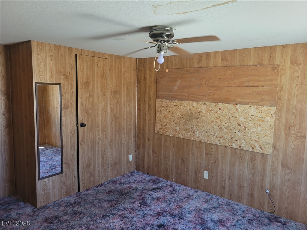 7950 South Wildhorse Road Pahrump, NV 89061 - Photo 11 of 28 Carpeted bedroom featuring ceiling fan